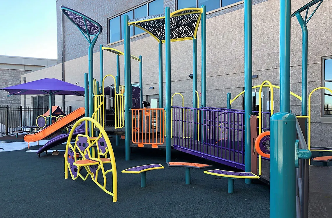 Playground bridge connecting play areas at Broomfield Community Center in Broomfield, CO